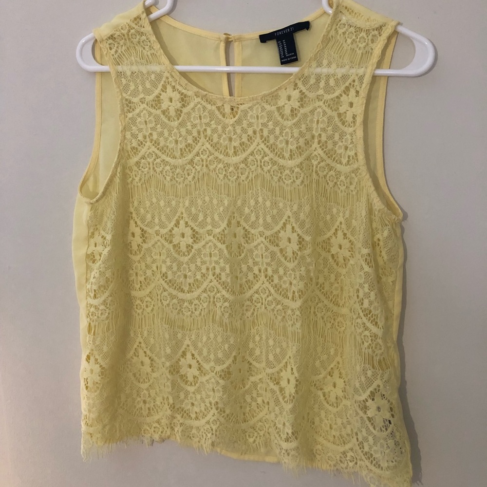Yellow tank top with cutout flower pattern